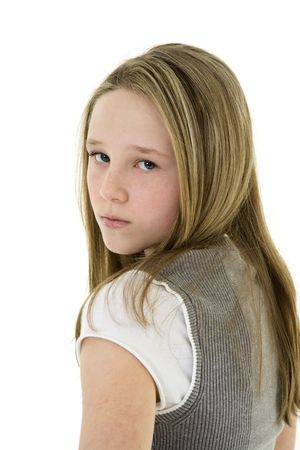 Caucasian preteen girl displaying some attitude while looking over shoulder