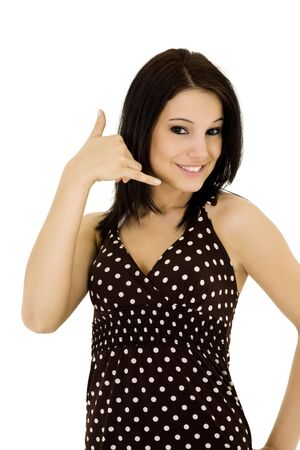 Beatiful Caucasian woman using her fingers to display the call me gestureの写真素材