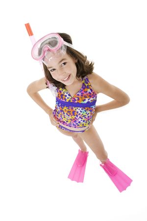 Caucasian child posing in a swimsuit standing on white backgroundの写真素材