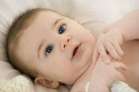 A very cute happy Caucasian baby boy