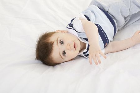 A very cute happy Caucasian baby boy