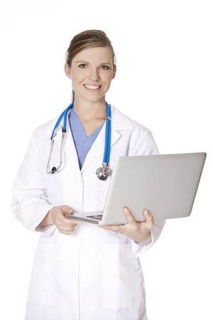 Beautiful Caucasian doctor or nurse holding a laptop computerの写真素材