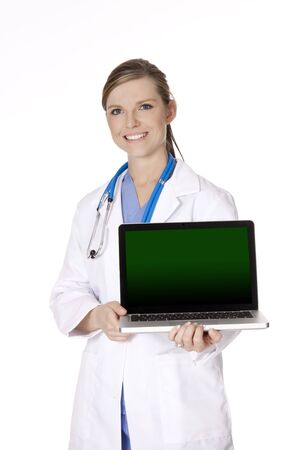 Beautiful Caucasian doctor or nurse holding a laptop computer の写真素材