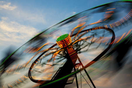 Amusement Rides with Movement Blur in the evening at the Kentucky State Fair Midway Louisville Kentuckyの写真素材