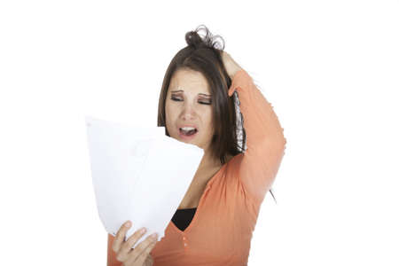 A beautiful Caucasian woman upset about incoming billsの写真素材