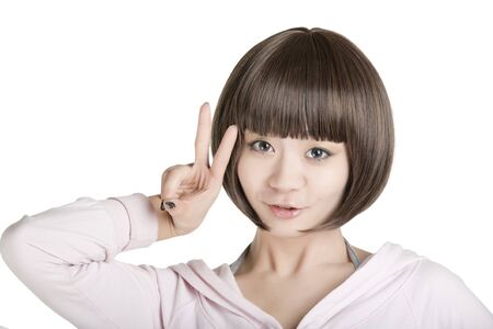 Beautiful Chinese woman displaying some attitude on a white backgroundの写真素材