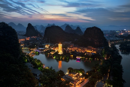 Mulong Pagoda also known as the Mulong Tower reflected in the Mulong Lake,  Mulong Lake Park, Guilin, Chinaの写真素材