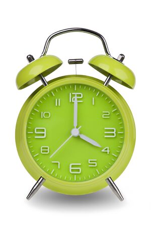 Green alarm clock with the hands at 4 am or pm isolated on a white background. One of a set of 12 images showing the top of the hour starting with 1 am / pm and going through all 12 hoursの写真素材
