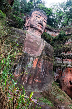 Leshan, China, April 3, 2017  The Leshan Giant Buddha is a 71-meter, 233 ft tall stone statue. Built between 713 and 803 during the Tang Dynasty. It is carved out of a cliff face that lies at the confluence of the Minjiang, Dadu and Qingyi rivers in the sのeditorial素材