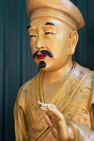 Lifesize Buddha statues line the walkway of the Ten Thousand Buddhas Monastery in Hong Kong Chinaの写真素材