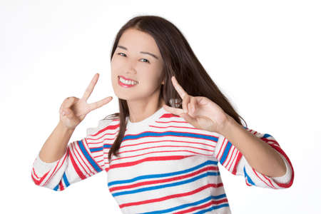 Portrait of a Beautiful Chinese American woman displaying a bit of attitude isolated on a white backgroundの写真素材