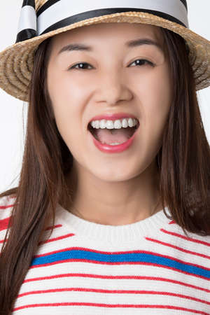 Portrait of a Beautiful Chinese American woman displaying a bit of attitude isolated on a white backgroundの写真素材