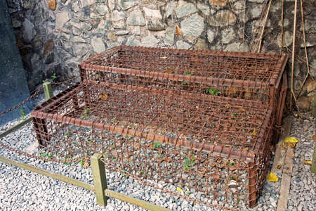 Tiger cages used by the American and South Vietnamse army during the Vietnam War to torture the Viet Cong, in the War Remnants Museum in Ho Chi Minh City Vietnamのeditorial素材
