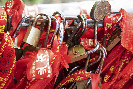 Ribbons and padlocks adorn the fences and handrails as a sign of good luck.  The World's First Bridge in Zhangjiajie National Forest Park, Hunan, Chinaのeditorial素材