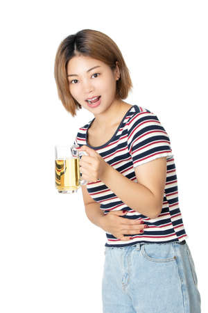 Beaufiful Chinese American woman holding a mug of beer isolated on white backgroundの写真素材