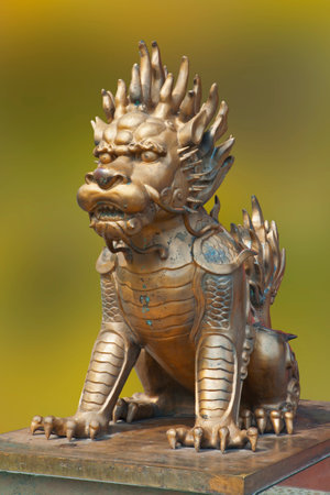 The mythical creature Kylin Oilins a symbol of power in China guarding the entrance to a building in Guilin Chinaの写真素材