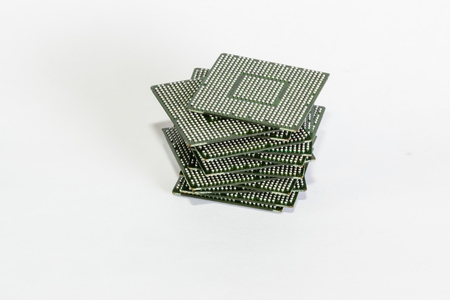 electronic chips isolated on white background. The chips are of different colors shapes and sizes.