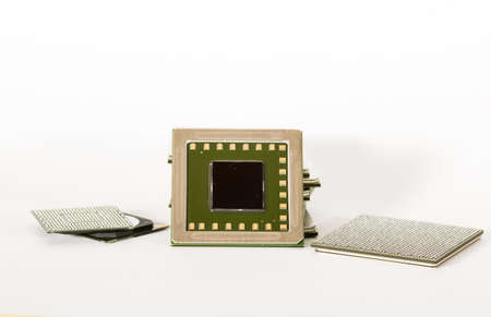 electronic chips isolated on white background. The chips are of different colors shapes and sizes.の写真素材