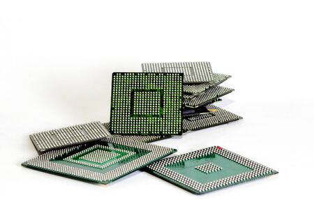 electronic chips isolated on white background. The chips are of different colors shapes and sizes.の写真素材