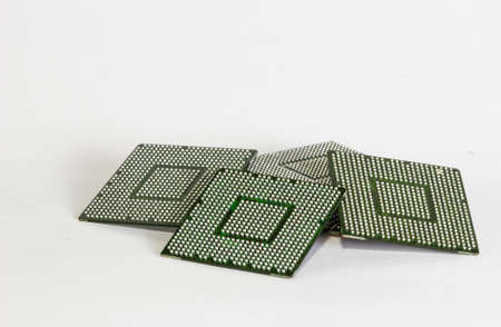 electronic chips isolated on white background. The chips are of different colors shapes and sizes.の写真素材