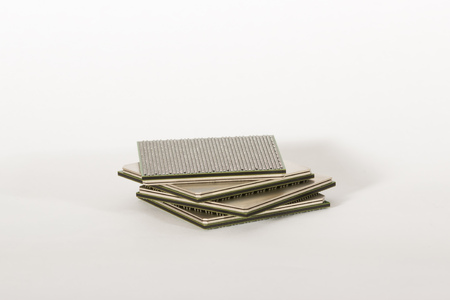 electronic chips isolated on white background. The chips are of different colors shapes and sizes.の写真素材