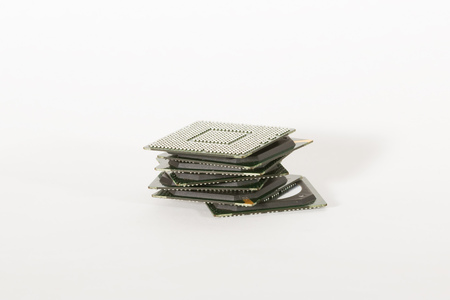 electronic chips isolated on white background. The chips are of different colors shapes and sizes.の写真素材