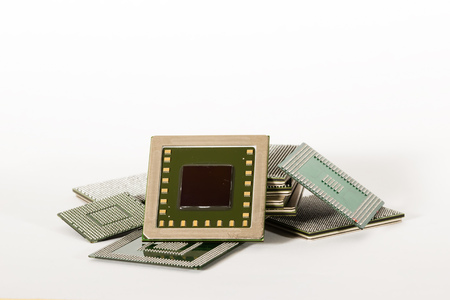 electronic chips isolated on white background. The chips are of different colors shapes and sizes.の写真素材
