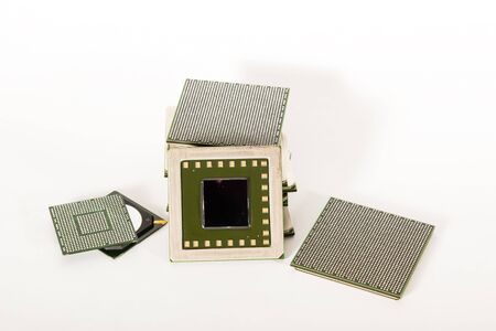 electronic chips isolated on white background. The chips are of different colors shapes and sizes.の写真素材