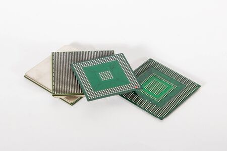 electronic chips isolated on white background. The chips are of different colors shapes and sizes.の写真素材