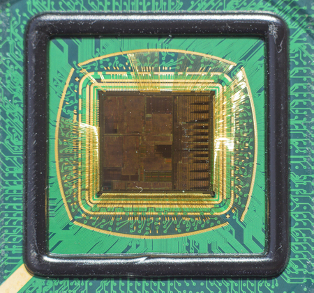 Open computer chip with gold wire connectionsの写真素材