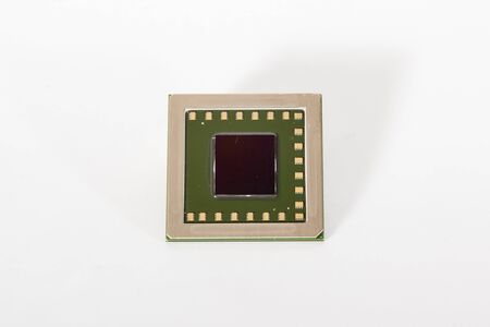 electronic chips isolated on white background. The chips are of different colors shapes and sizes.の写真素材