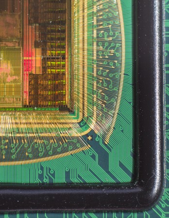 Open computer chip with gold wire connectionsの写真素材