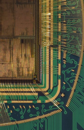 Open computer chip with gold wire connectionsの写真素材