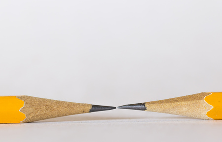 A group of pencils isolated on white. The pencils tips are nearly touching each other.This is a macro image.の写真素材