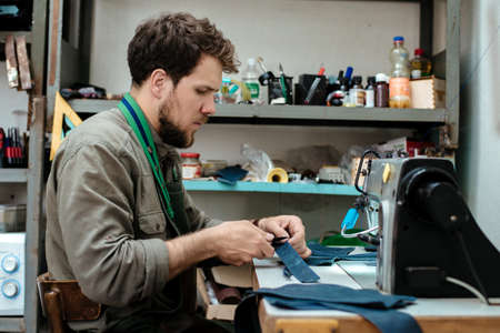 A master works with genuine leather making exclusive things