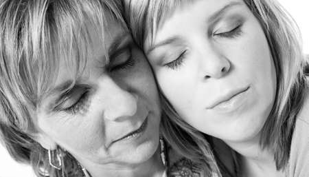 A portrait taken from mother and daughter taken on a white backgroundの写真素材