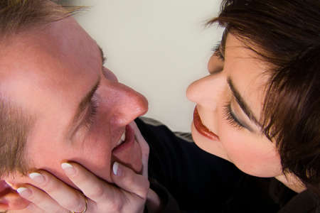 Married lovers portraits taken in the photo studio on different backgrounds