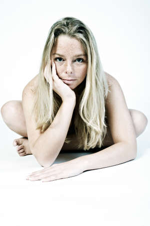 Blond woman in the studio on a white background doing the welness shootの写真素材
