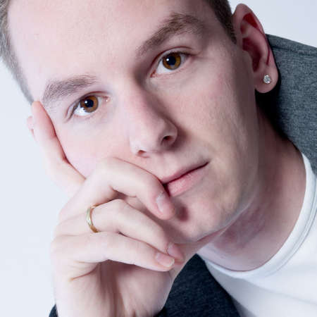 boy whos thinking and looking in the cameraの写真素材