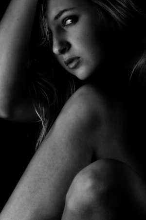 Beautiful woman portrait on a black backgroundの写真素材