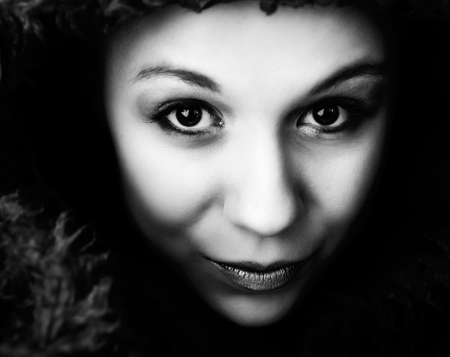 Beautiful young goodlooking woman with a pluche sweaterの写真素材