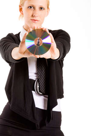 Friendly business woman presenting a compact diskの写真素材