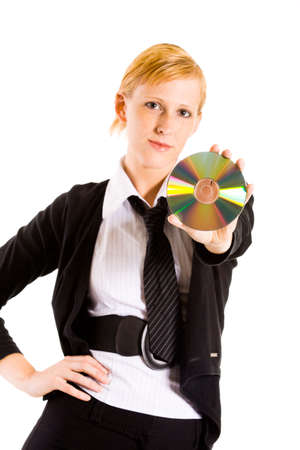 Friendly business woman presenting a compact disk. Focus is on the CDの写真素材