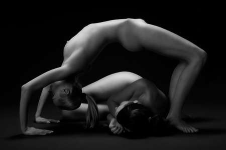 2 Nakes woman in artistical gymnastic posesの写真素材