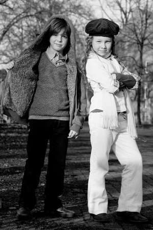 Young boy and girl with a big fashion attitudeの写真素材