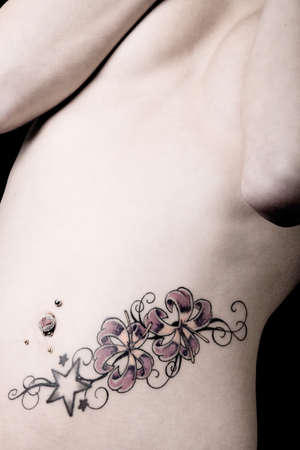 Woman  with different tattoos designed by herselfの写真素材