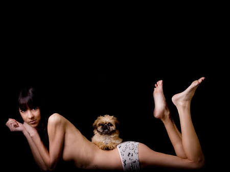 Brunette woman with a cute little pekingeseの写真素材