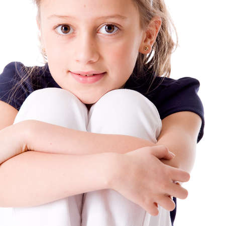 Young brunette child posing in different clothesの写真素材