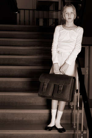 Young girl on school with a old school outfitの写真素材