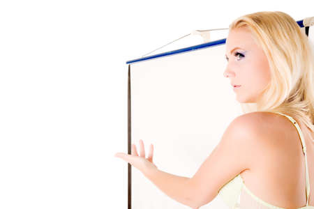 Lingery model standing next to a white projector screen.Ideal for using as copy space for your messageの写真素材